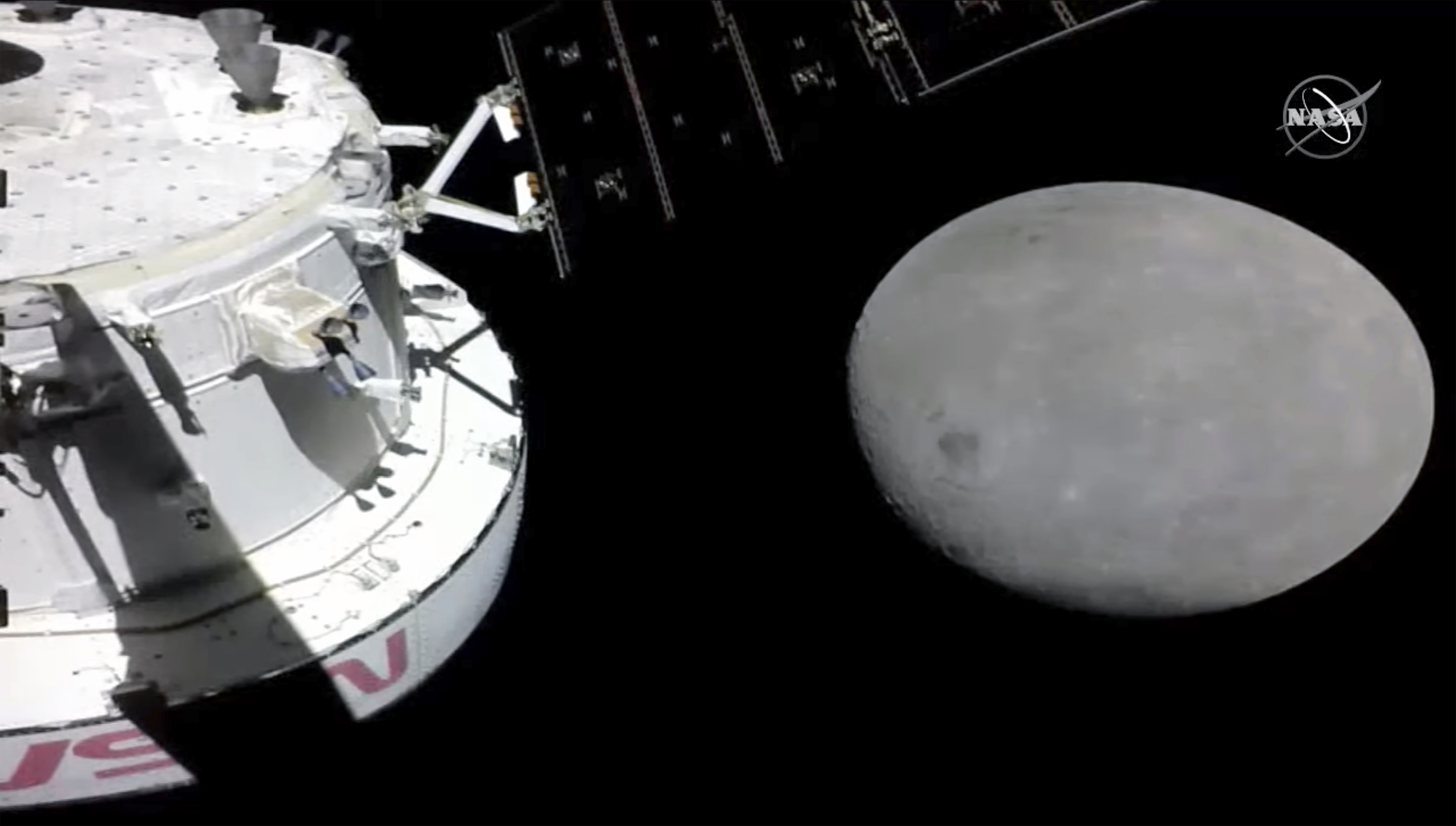 NASA Capsule Buzzes Moon, Last Big Step Before Lunar Orbit
