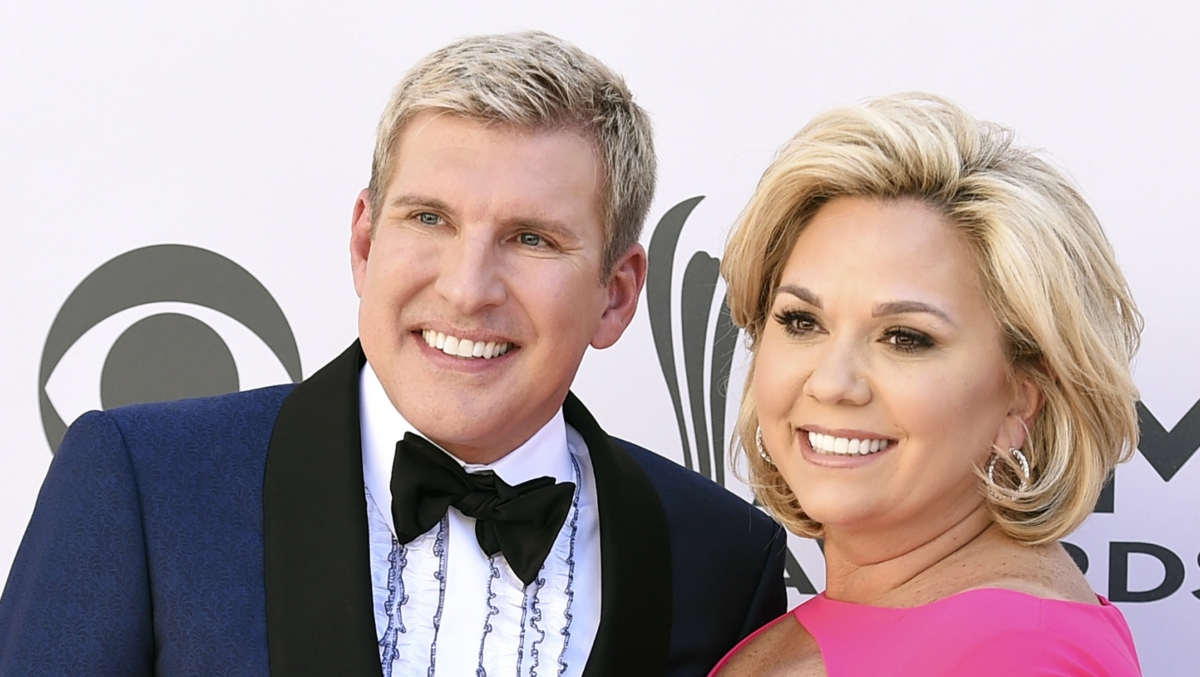 Todd Chrisley (L) and his wife Julie Chrisley pose for photos at the 52nd annual Academy of Country Music Awards in Las Vegas on April 2, 2017. (Jordan Strauss/Invision/AP)