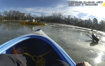 Rescuers Use Kayaks to Reach Pilot After Crash in Icy Creek