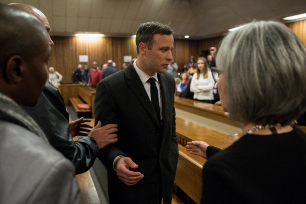 Olympic athlete Oscar Pistorius speaks with relatives after sentencing at the High Court at the High Court in Pretoria, South Africa, on July 6, 2016. (Marco Longari/Pool/Getty Images)