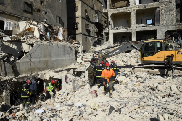 Algerian rescue teams (red helmets) take part in the search and rescue operations in Syria's northern city of Aleppo on Feb. 8, 2023. (AFP via Getty Images)