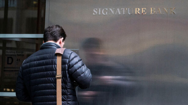 A worker arrives to the Signature Bank HQ in New York City