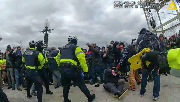 D.C. police officer Daniel Thau drops a protester with a taser at the U.S. Capitol 