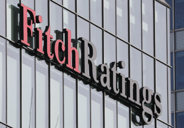 The Fitch Ratings Logo Is Seen At Their Offices At Canary Wharf Financial District In London