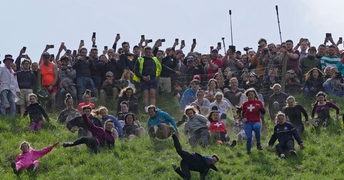 Rolling Thunder Contestants Chase Cheese Wheel Down a Hill in Chaotic