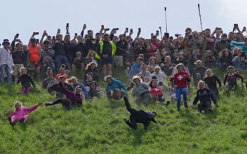 Rolling Thunder: Contestants Chase Cheese Wheel Down a Hill in Chaotic UK Race
