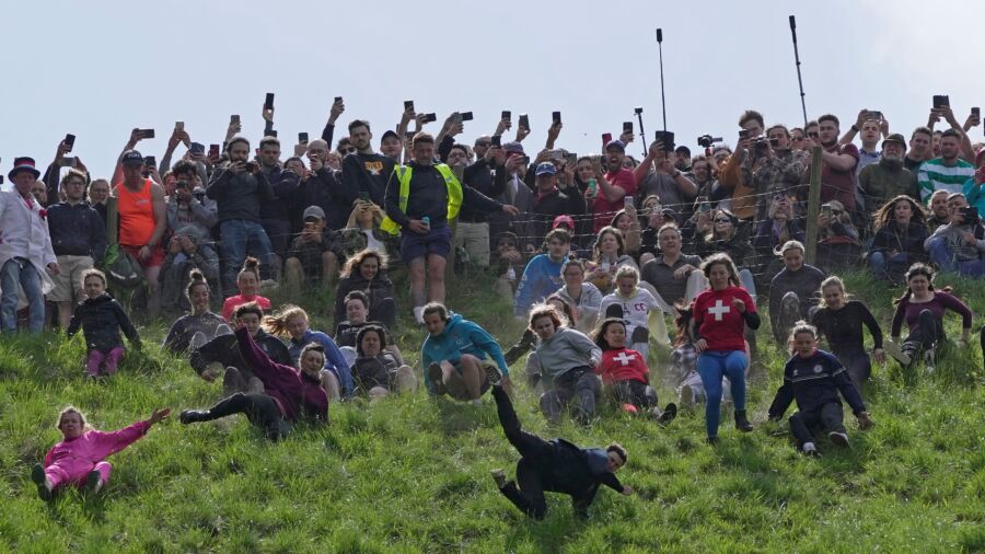 Rolling Thunder: Contestants Chase Cheese Wheel Down a Hill in Chaotic UK Race