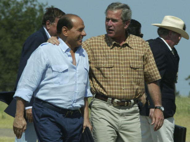 President Bush embraces Italy’s Prime Minister Silvio Berlusconi as he welcomes him to his ranch in Crawford, Texas on July 20, 2003. (Charles Dharapak/AP Photo)