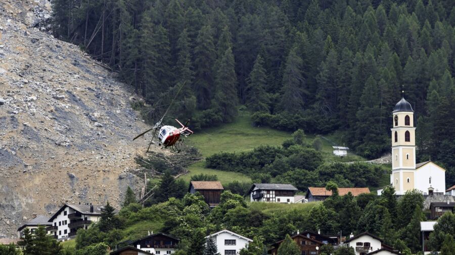Mass of Rock Slides Down Swiss Mountainside Above Evacuated Village, Narrowly Missing Settlement