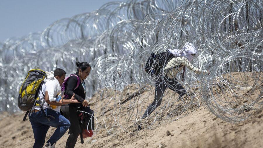 CBP Defends Footage of Border Patrol Agent Cutting Razor Wire to Let in Illegal Border Crossers