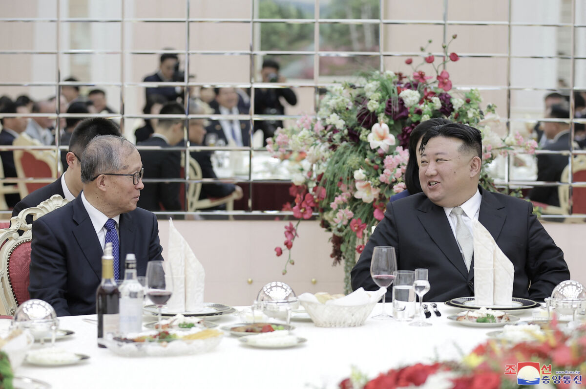 North Korean leader Kim Jong Un speaks with Chinese Communist Party politburo member Li Hongzhong (L) during an event in Pyongyang, North Korea, on July 28, 2023, in this image released by North Korea's state-run Korean Central News Agency. (KCNA via Reuters)