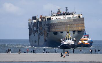 A Car-Carrying Ship That Burned for a Week on the North Sea Is Towed to a Dutch Port for Salvaging