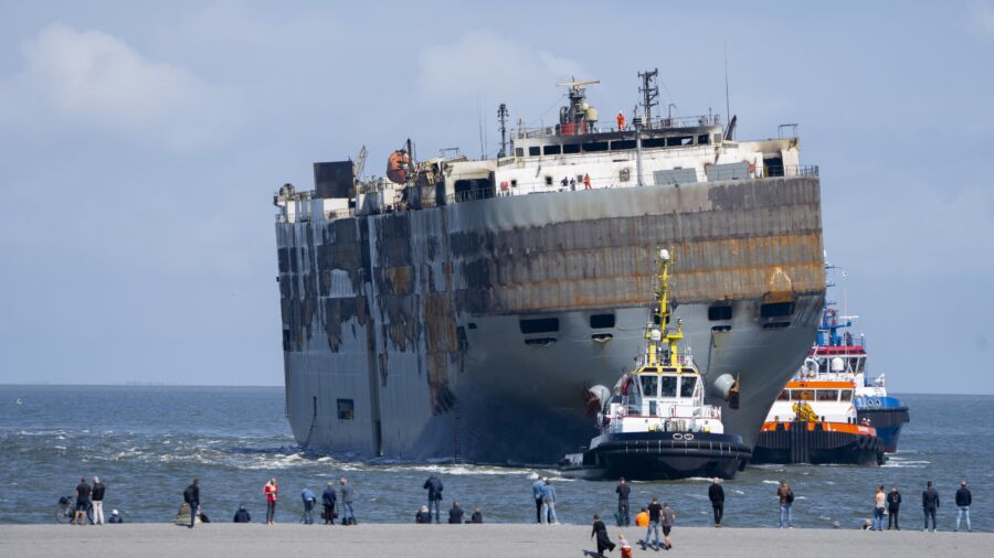 A Car-Carrying Ship That Burned for a Week on the North Sea Is Towed to a Dutch Port for Salvaging