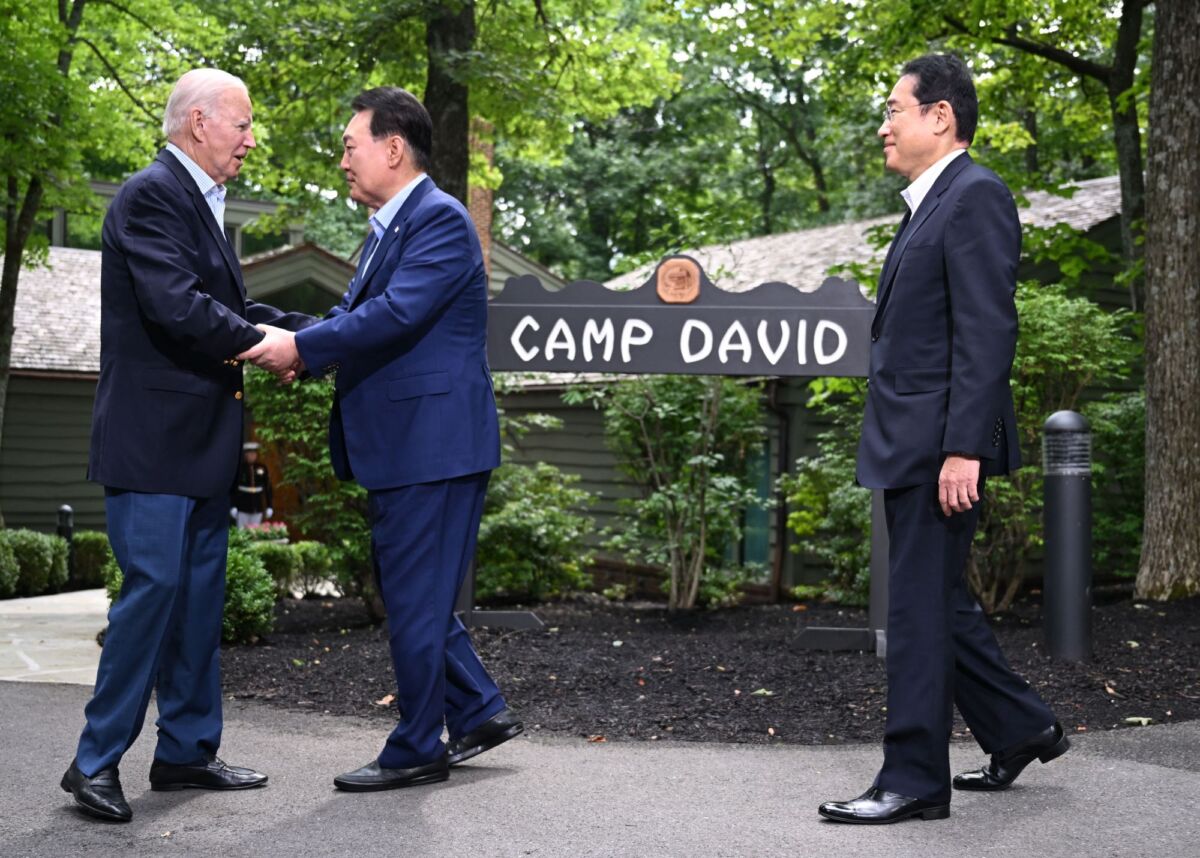 President Joe Biden (L) welcomes South Korean President Yoon Suk Yeol (C) and Japanese Prime Minister Fumio Kishida to Camp David, Md., for a Trilateral Summit on Aug. 18, 2023. (Jim Watson/AFP via Getty Images)