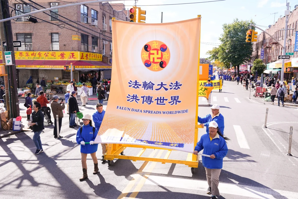 Falun Gong practitioners walk in a parade