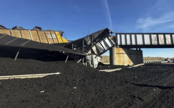Colorado Train Derails, Spilling Train Cars and Coal Onto Highway and Trapping Semi-Truck Driver