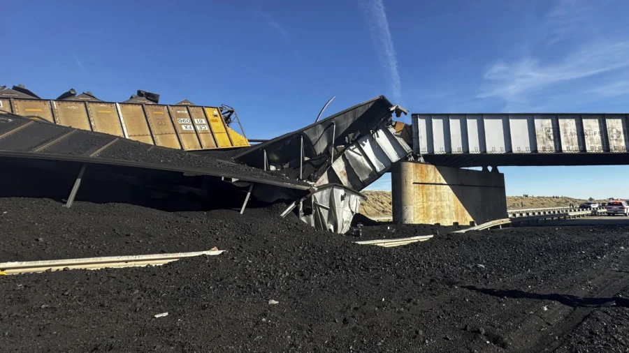 Colorado Train Derails, Spilling Train Cars and Coal Onto Highway and Trapping Semi-Truck Driver