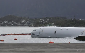 US Navy Removes Fuel From Plane That Overshot Hawaii Runway and Is Now Resting on Reef and Sand