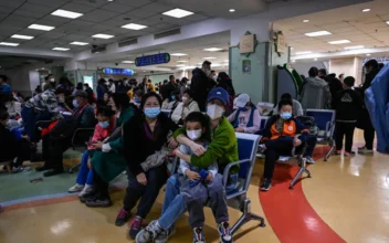 Children and their parents wait at an outpatient area at a children’s hospital in Beijing on Nov. 23, 2023. (Jade Gao/AFP via Getty Images)