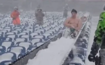 Video: Fan Slides Down Snow-Filled Chute at Buffalo Bills’ Stadium