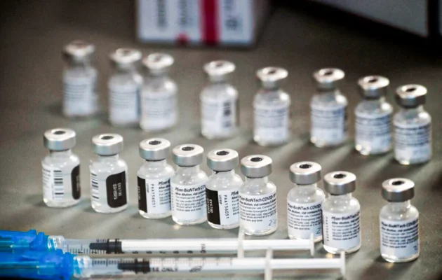 Syringes and vials of the Pfizer-BioNTech COVID-19 vaccine are prepared to be administered at a drive-up vaccination site in Reno, Nev., on Dec. 17, 2020. (Patrick T. Fallon/AFP via Getty Images)