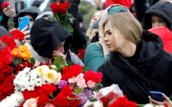 Russians Lower Flags in Mourning, Suspects Charged in Deadly Concert Hall Attack
