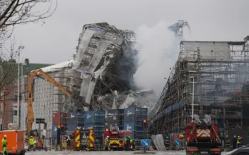 Firefighters Tackle Scaffolding Dangling Outside Ruins of Fire-Ravaged Danish Landmark