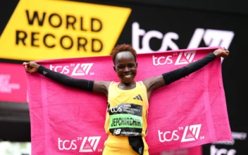 Peres Jepchirchir of Kenya celebrates after winning the Women's elite race and setting a new world record during the 2024 TCS London Marathon, in London, England on April 21, 2024. (Alex Davidson/Getty Images)