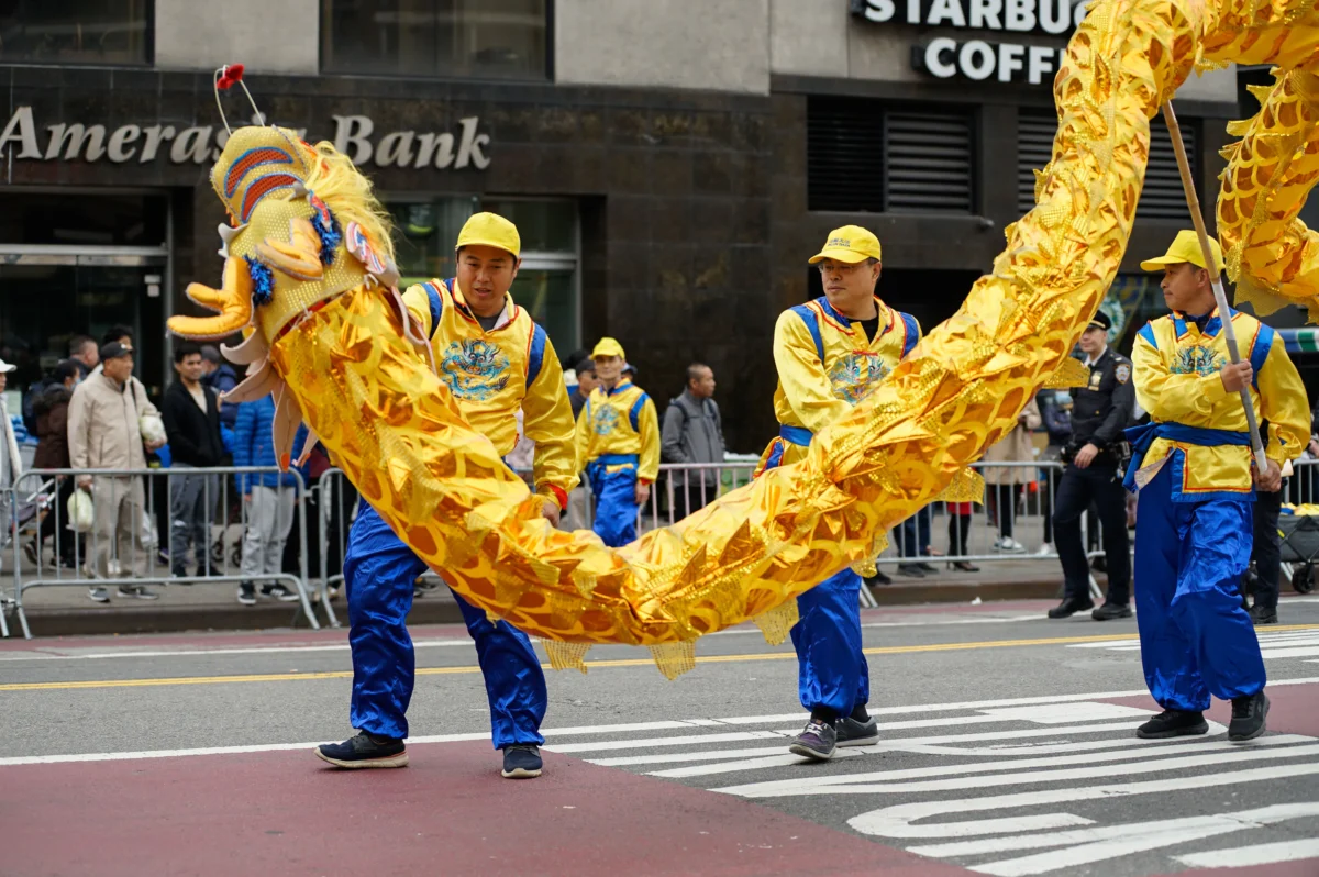 Falun Gong practitioners attend a parade