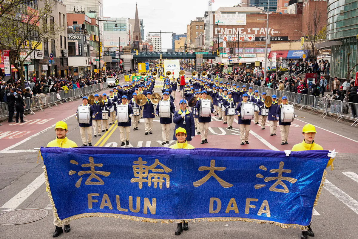 Falun Gong practitioners attend a parade