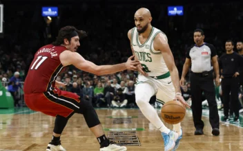 Jaime Jaquez Jr. #11 of the Miami Heat tries to stop Derrick White #9 of the Boston Celtics from going past him during the second half of game one of the Eastern Conference First Round Playoffs at TD Garden in Boston, on April 21, 2024. (Winslow Townson/Getty Images)