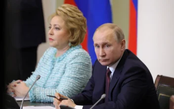Russian President Vladimir Putin (R) and Chairwoman of the Russian Federation Council Valentina Matviyenko (L) attend a meeting on the occasion of Russian Parliamentarianism Day in Saint Petersburg, Russia, on April 27, 2018. (Mikhail Klimentyev/Sputnik/AFP via Getty Images)