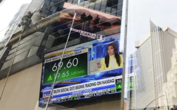News of Trump Media & Technology Group public trading is seen on television screens at the Nasdaq Marketplace in New York City on March 26, 2024. (Michael M. Santiago/Getty Images)
