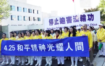 Falun Gong practitioners rally outside the Chinese embassy in Washington to commemorate the peaceful appeal that happened in Beijing 25 years ago, on April 20, 2024. (Courtesy of Minghui.org)