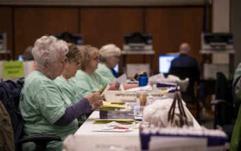 Election volunteers prepare mail-in ballots for scanning at the Lancaster County Government Center in Lancaster, Pa., on April 23, 2024. (Madalina Vasiliu/The Epoch Times)