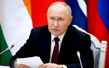 Russia's President Vladimir Putin attends a virtual summit of the BRICS group of nations (the bloc that includes Brazil, Russia, India, China and South Africa) to discuss the Israel-Hamas war, in Moscow on Nov. 21, 2023. (Alexander Kazakov/Pool/AFP via Getty Images)
