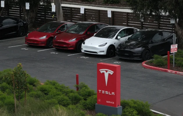In an aerial view, Tesla car sits parked in a lot at a Tesla service facility on April 24, 2024 in Fremont, California. (Justin Sullivan/Getty Images)