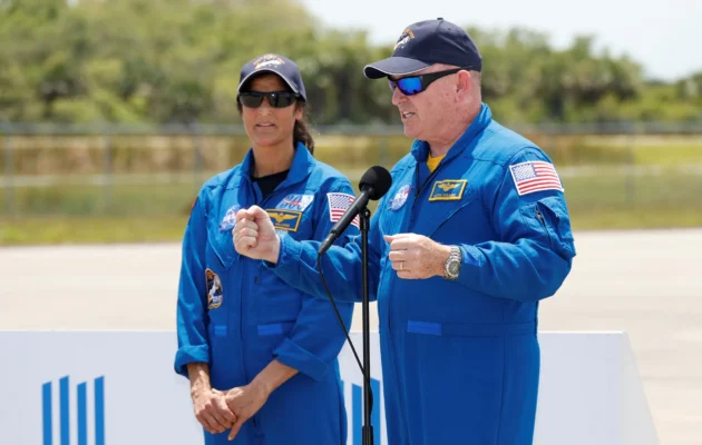 NASA astronauts Butch Wilmore, right, and Suni Williams speak to the media after they arrived at the Kennedy Space Center in Cape Canaveral, Fla., on Thursday, April 25, 2024. (AP Photo/Terry Renna)