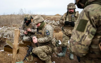 Ukrainian servicemen prepare their weapons during a military training exercise near the front line in the Donetsk region, on Feb. 23, 2024. (Anatolii Stepanov/AFP via Getty Images)