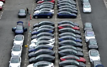 In an aerial view, workers prepare brand new Tesla cars for delivery at the Tesla Fremont Factory on April 24, 2024 in Fremont, California. (Justin Sullivan/Getty Images)