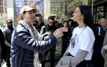 A pro-Palestinian supporter (L) and a supporter of Israel argue with each other on the sidewalk after people participated in the "Bring Them Home Now" rally, calling for the release of Israeli hostages kidnapped by Hamas on Oct. 7, 2023, outside of Columbia University in New York on April 26, 2024. (Timothy A. Clary/AFP via Getty Images)
