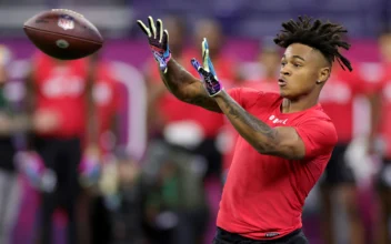 Wide receiver Tank Dell of Houston participates in a drill during the NFL Combine at Lucas Oil Stadium in Indianapolis, Ind., on March 4, 2023. (Stacy Revere/Getty Images)