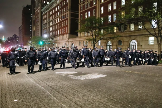 NYPD officers in riot gear march