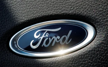 The Ford name plate is seen on the interior of a Ford F-150 Lightning pickup truck during a press event in New York on May 26, 2021. (Brendan McDermid/Reuters)