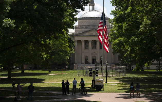 A barricade protects the American flag at Polk Place at the University of North Carolina in Chapel Hill, on May 1, 2024. (Sean Rayford/Getty Images)