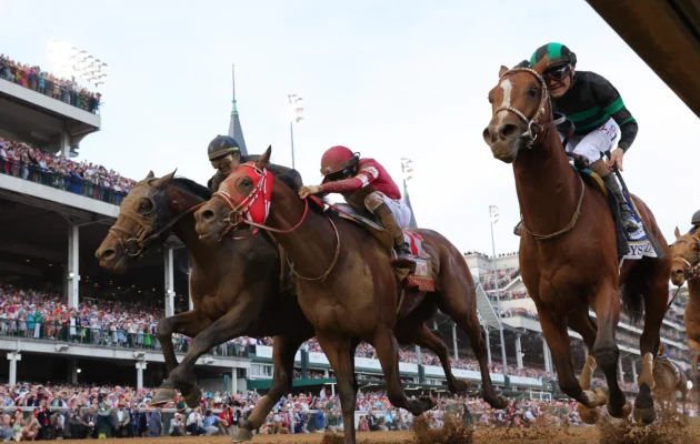 Mystik Dan (3), ridden by jockey Brian J. Hernandez Jr. (R), crosses the finish line ahead of Sierra Leone (2), ridden by jockey Tyler Gaffalione and Forever Young, ridden by jockey Ryusei Sakai to win the 150th running of the Kentucky Derby at Churchill Downs in Louisville, Ky., on May 4, 2024. (Michael Reaves/Getty Images)