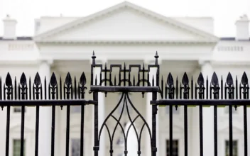 The White House is visible through the fence at the North Lawn on June 16, 2016. (Andrew Harnik/AP Photo)