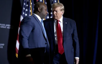 Republican presidential candidate, former President Donald Trump thanks Sen. Tim Scott (R-S.C.) (L) for introducing him as he arrives on stage for a Get Out The Vote rally at the North Charleston Convention Center in North Charleston, S.C., on Feb. 14, 2024. (Win McNamee/Getty Images)