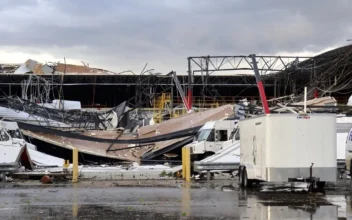 Debris is seen from a damaged FedEx facility after a tornado in Portage, Mich., on May 7, 2024. (Brad Devereaux/Kalamazoo Gazette via AP)