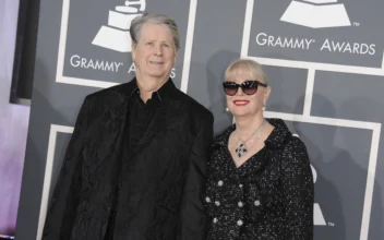 Musician Brian Wilson (L) and his wife Melinda Ledbetter Wilson arrive at the 55th annual Grammy Awards in Los Angeles on Feb. 10, 2013. (Jordan Strauss/Invision/AP)